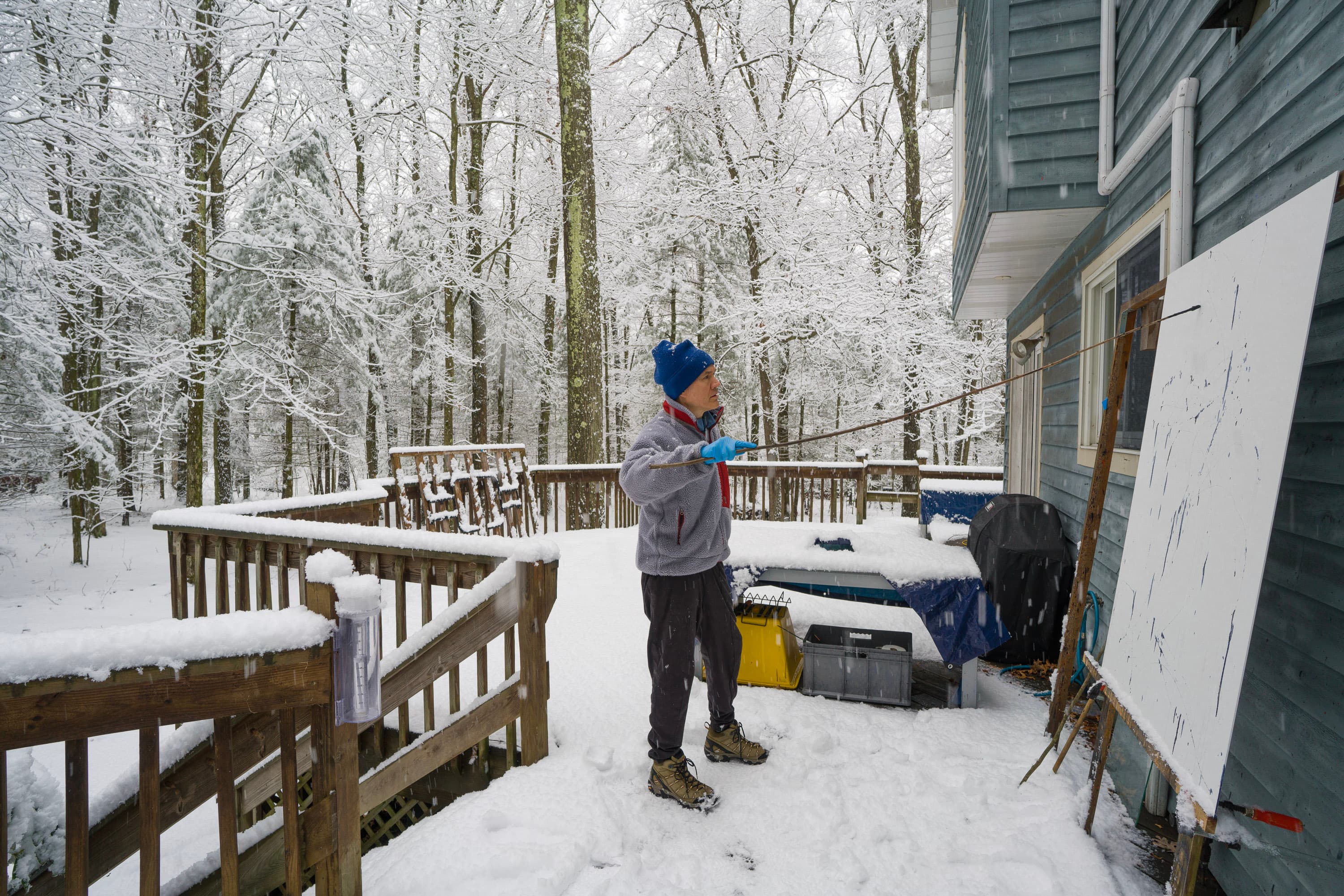 Christopher painting in the snow