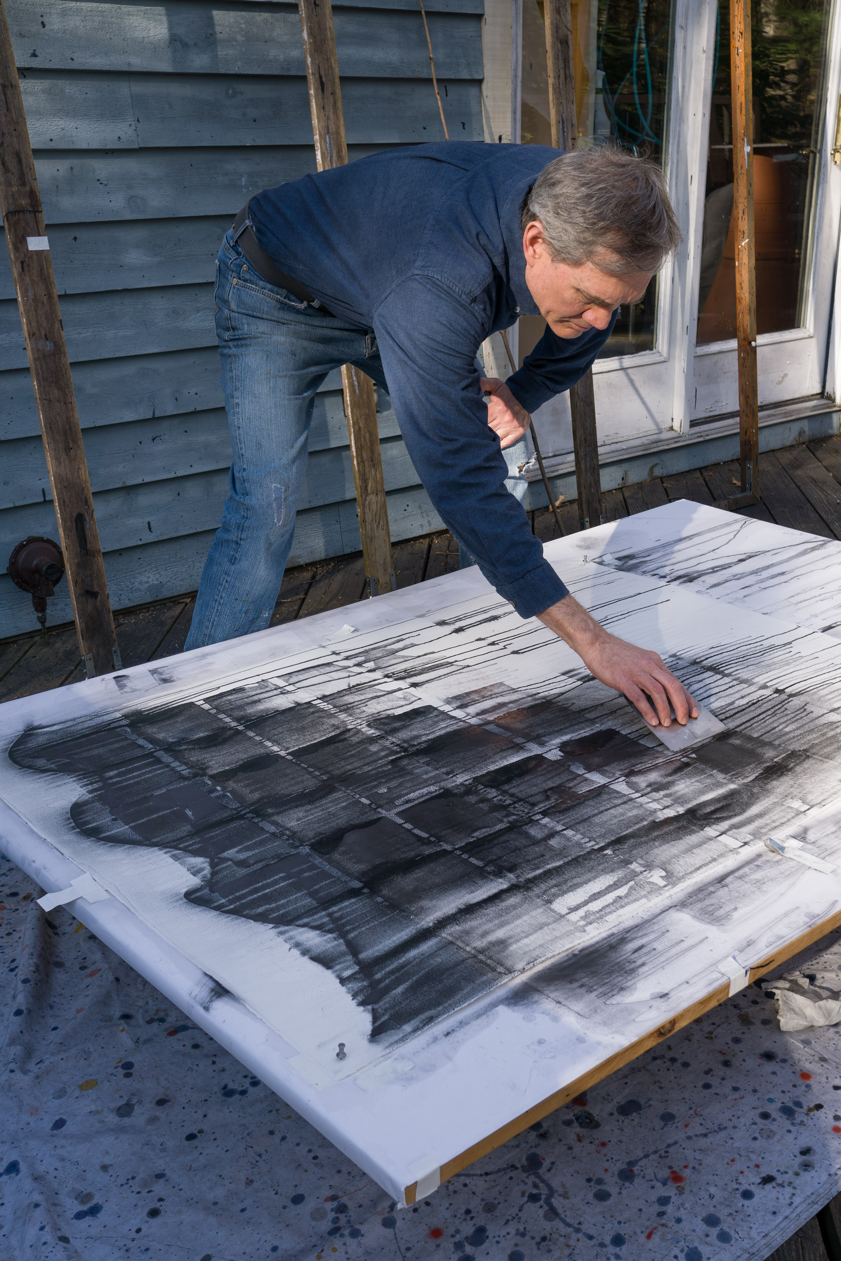 Outdoor studio, working with a stainless steel blade in a horizontal plane.